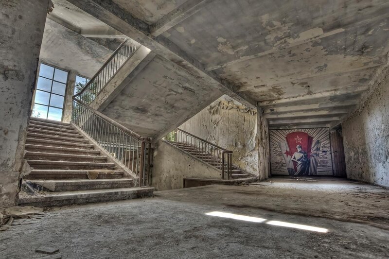 Abandoned building interior with mural