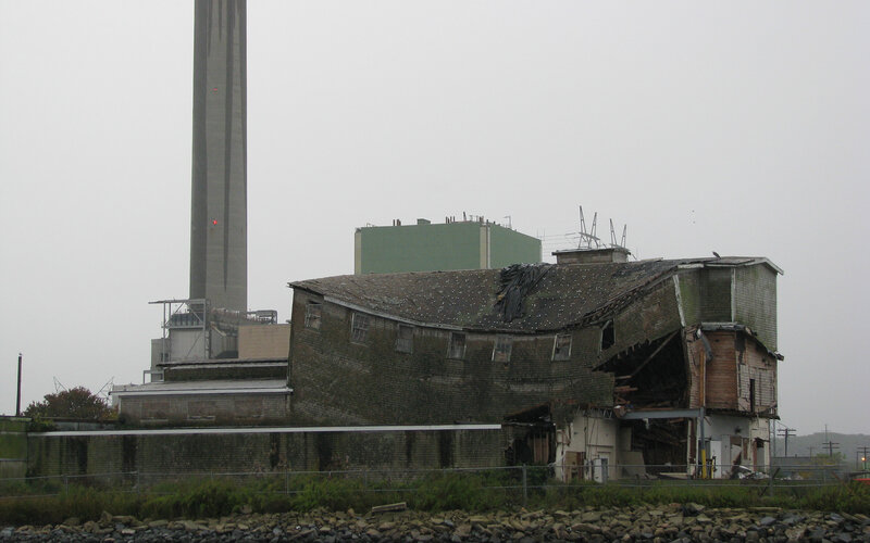 Abandoned building near industrial plant