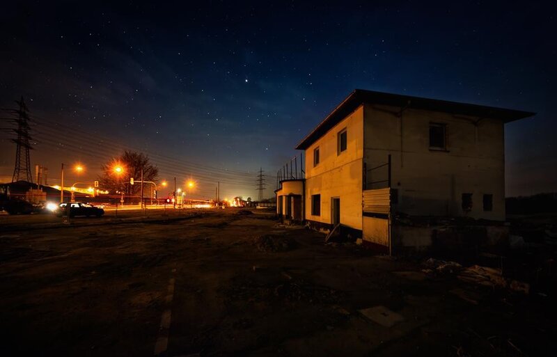 Abandoned building under starry sky