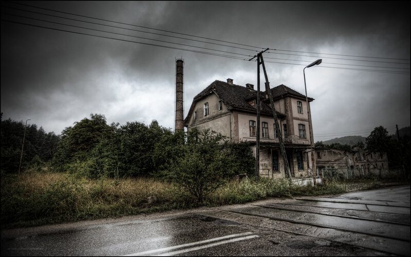 abandoned building under stormy sky
