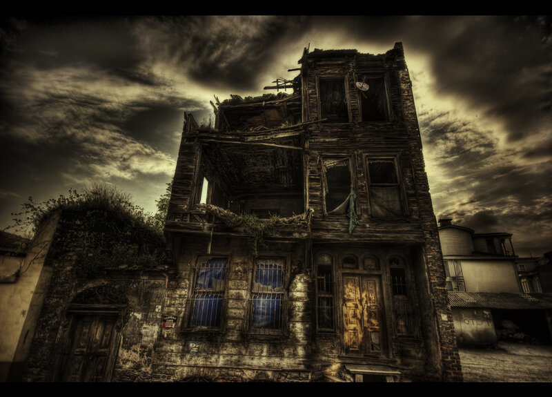 Abandoned building under stormy sky