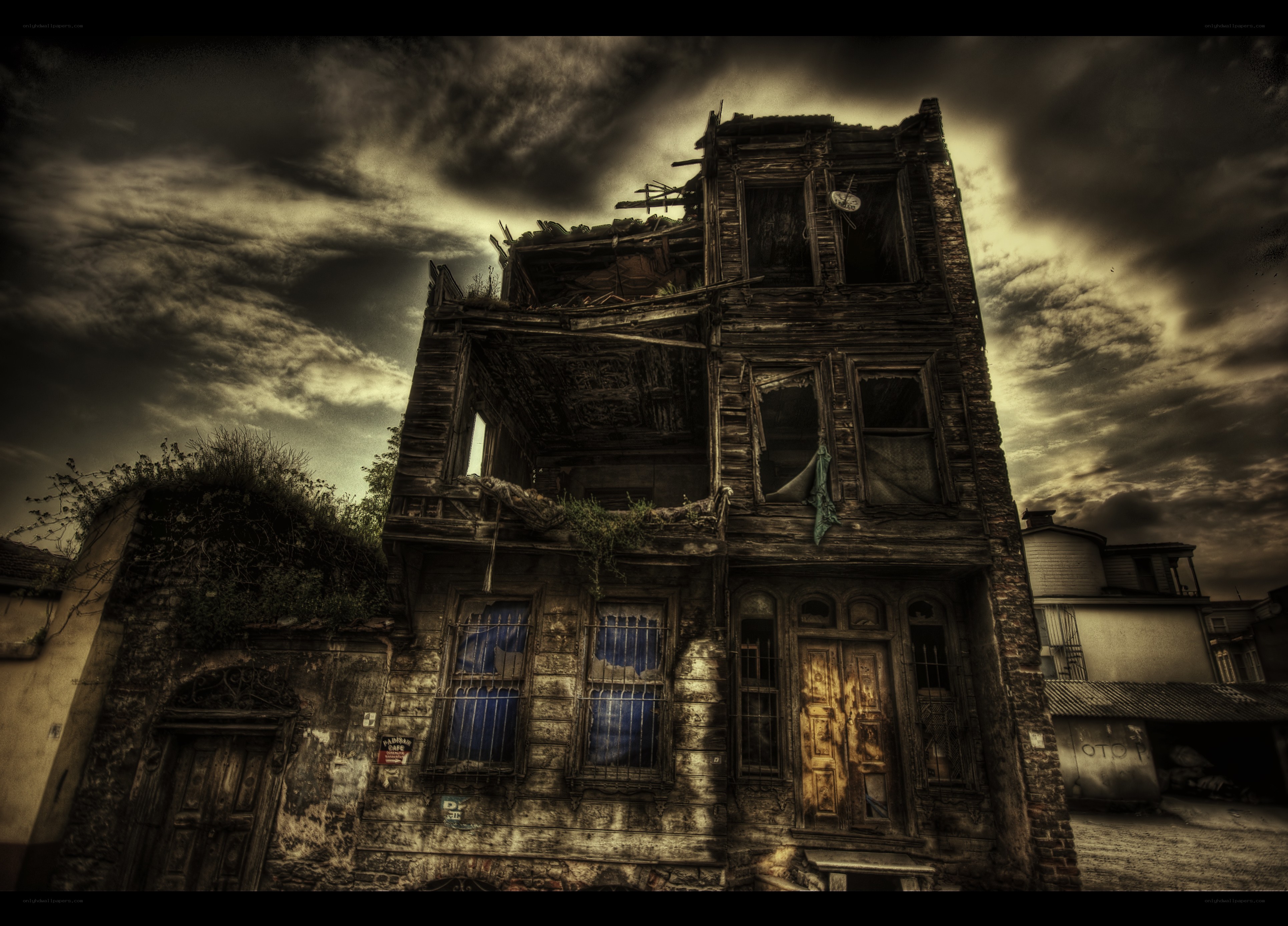 Abandoned building under stormy sky