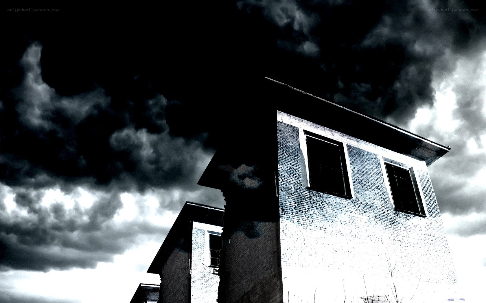 abandoned building under stormy sky