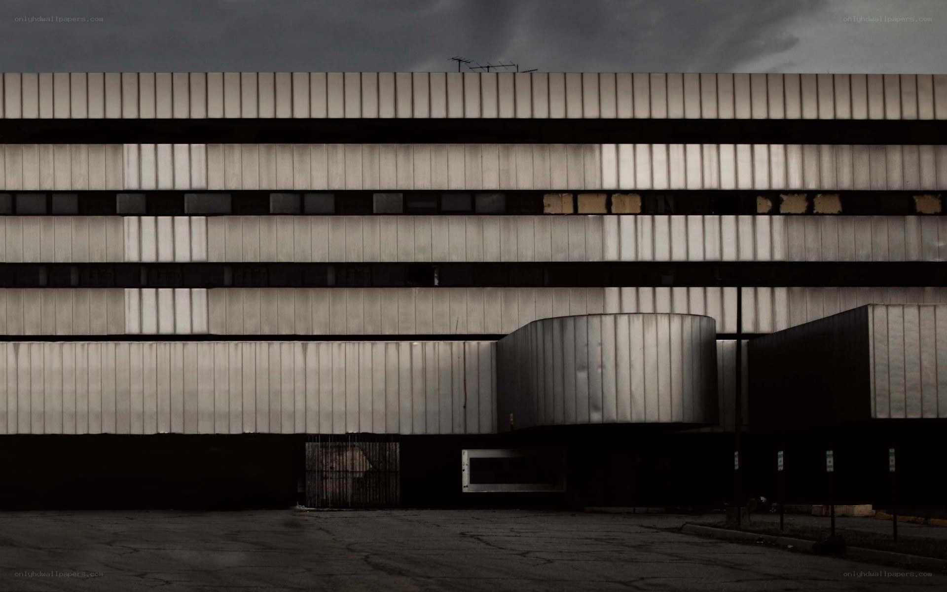 abandoned building under stormy sky