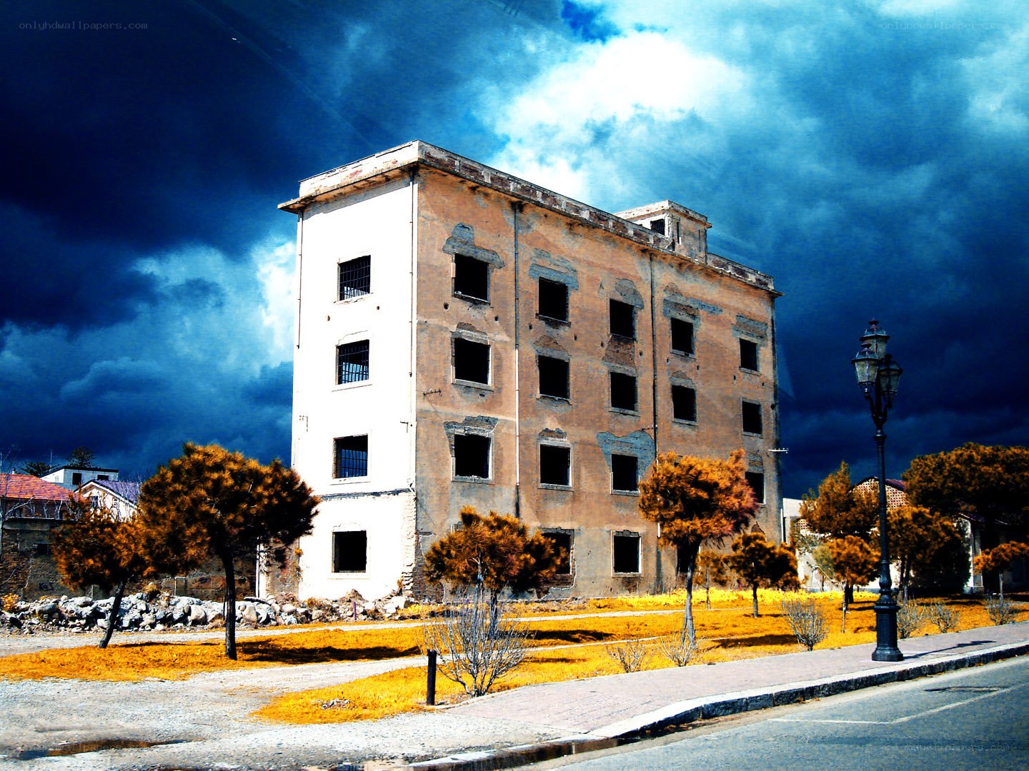 Abandoned building under stormy sky