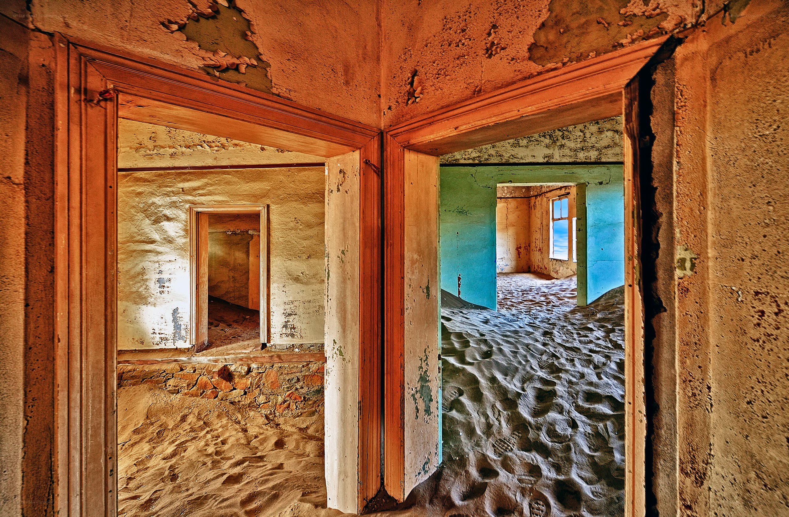 Abandoned building with sand