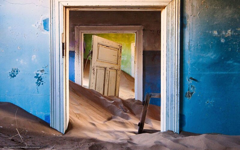 Abandoned building with sand