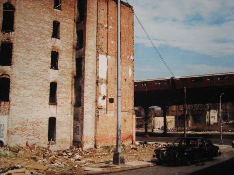 Abandoned building with train overpass