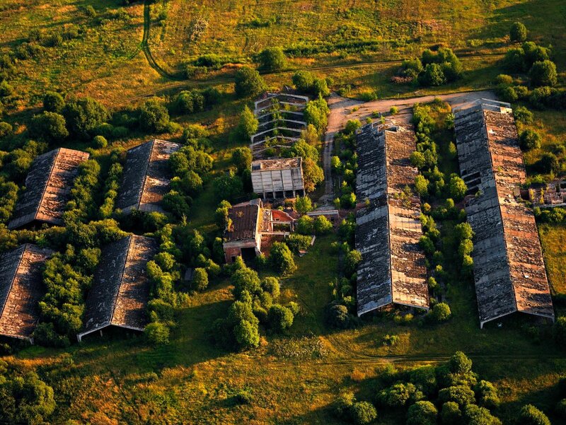 Abandoned buildings in a field
