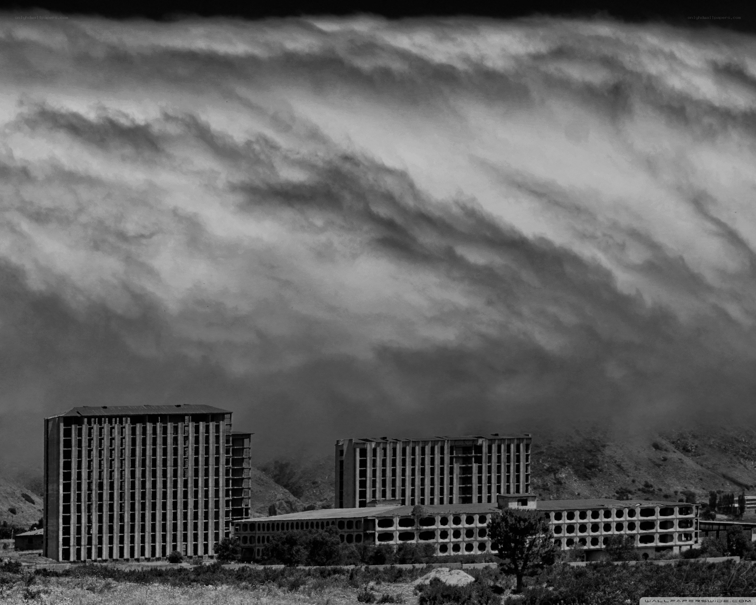 Abandoned buildings under stormy sky