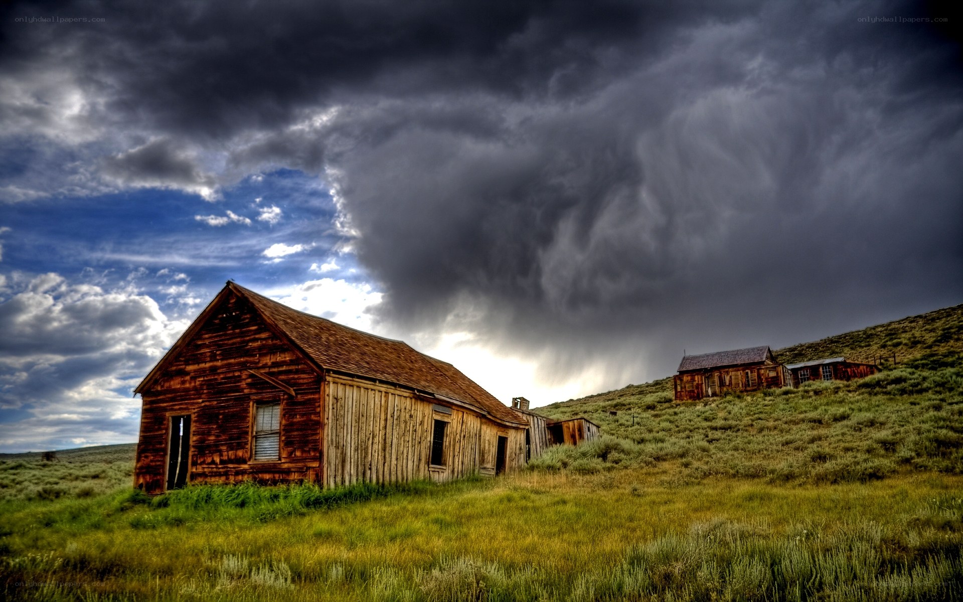 Abandoned buildings under stormy sky