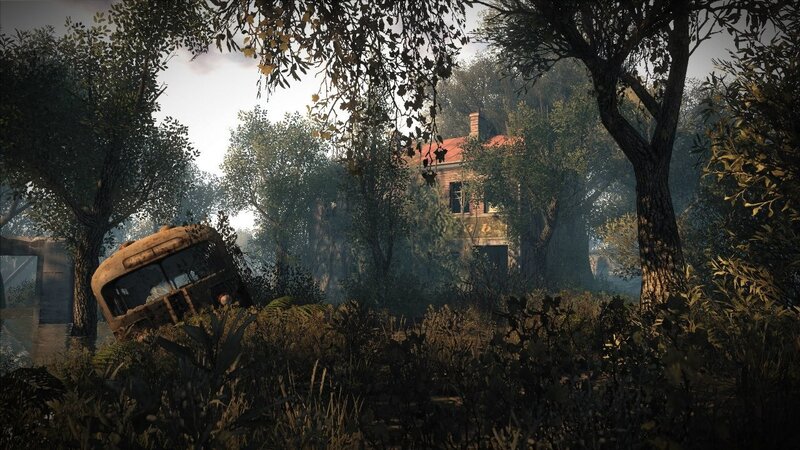Abandoned bus and house in forest