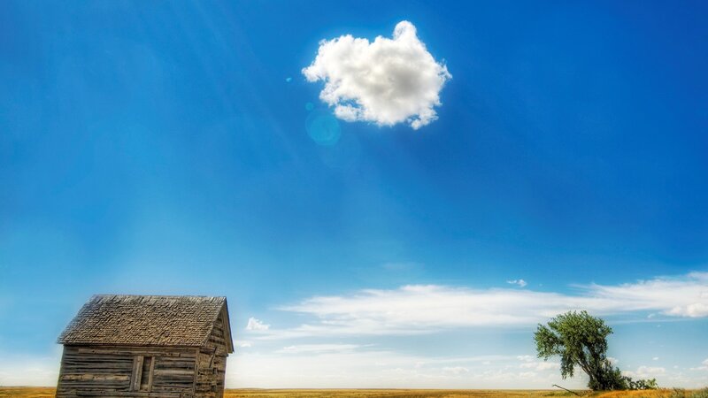 Abandoned Cabin in Field — Blue, Serene, Afternoon
