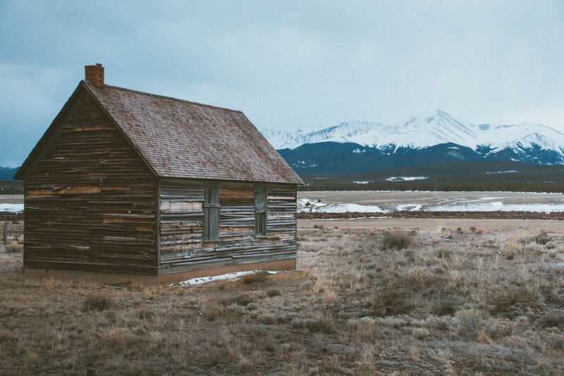 Abandoned Cabin in Field — Brown, Desolate, Winter