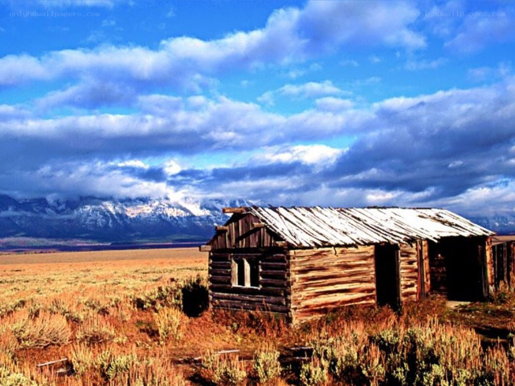 Abandoned cabin in mountain valley