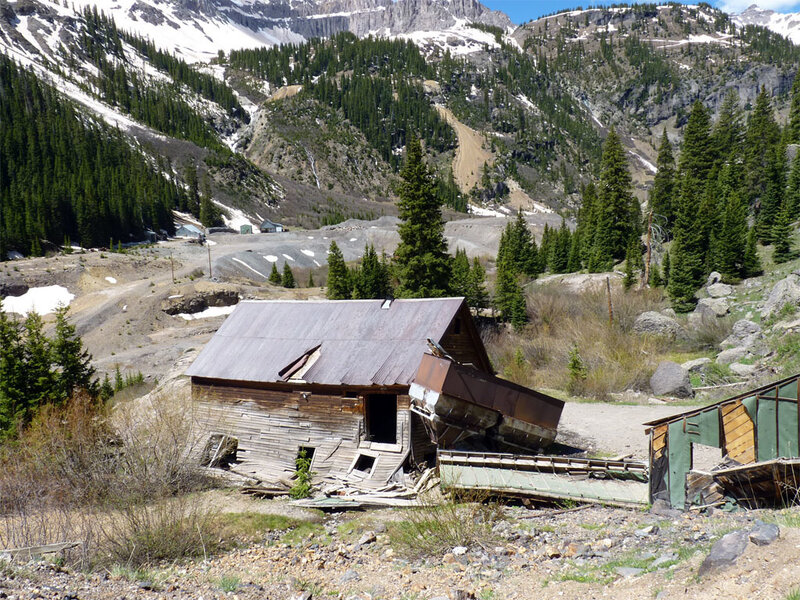 Abandoned cabin in mountain valley