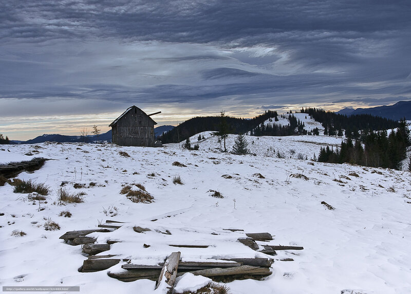 Abandoned cabin in snowy mountains