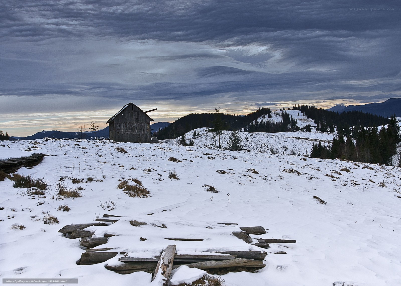 Abandoned cabin in snowy mountains