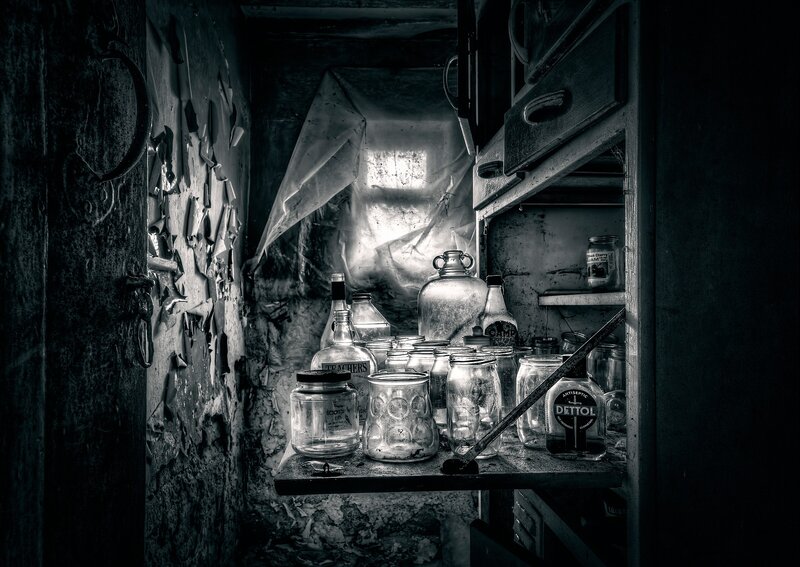 Abandoned Cabinet with Bottles