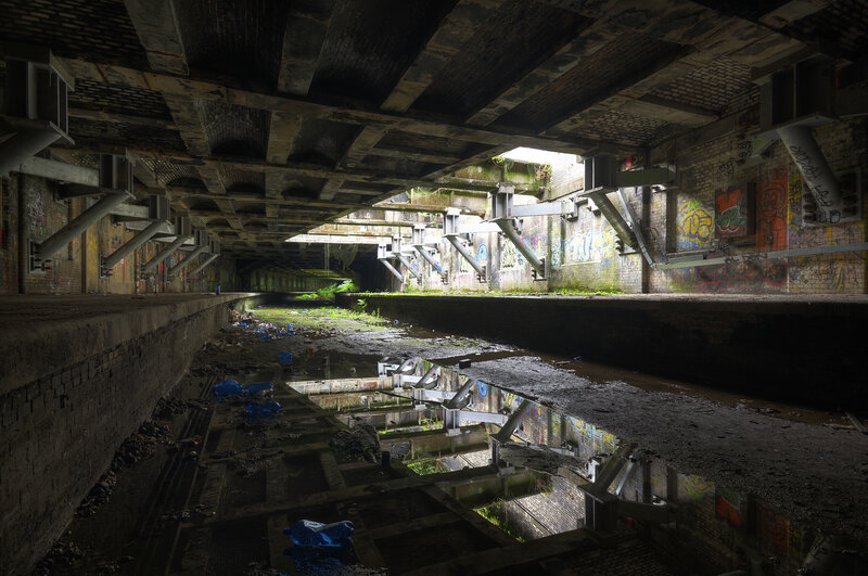 Abandoned canal under bridge