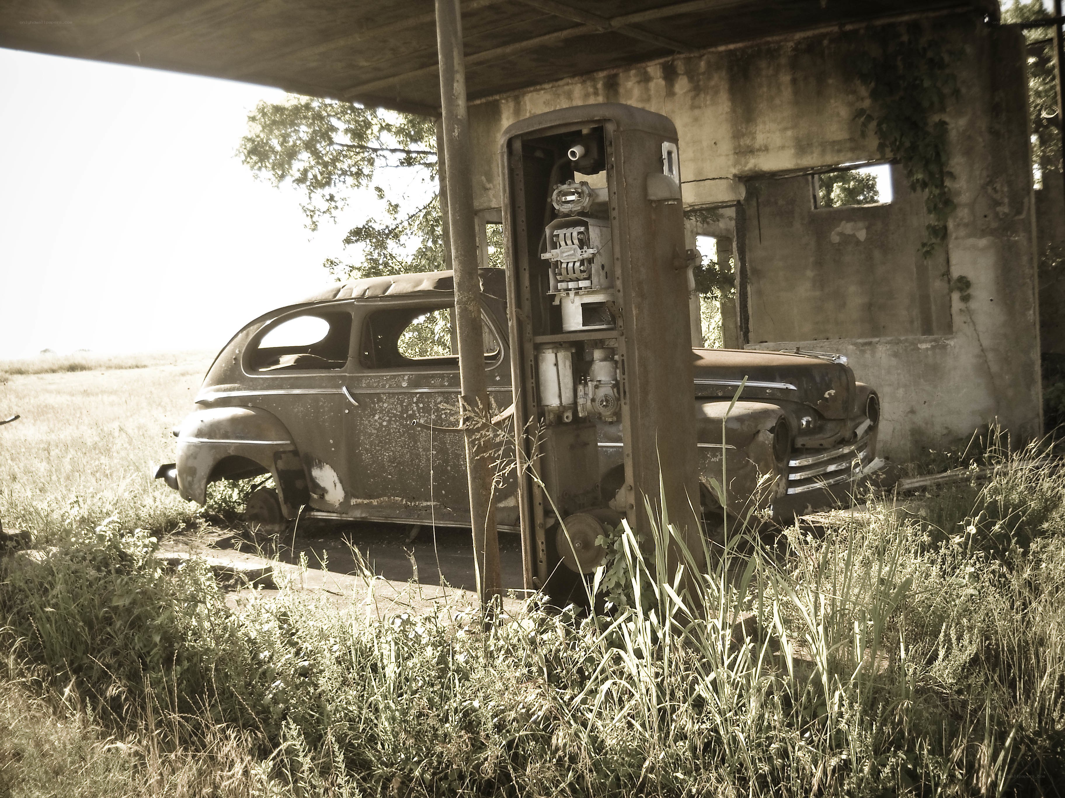Abandoned car and gas pump