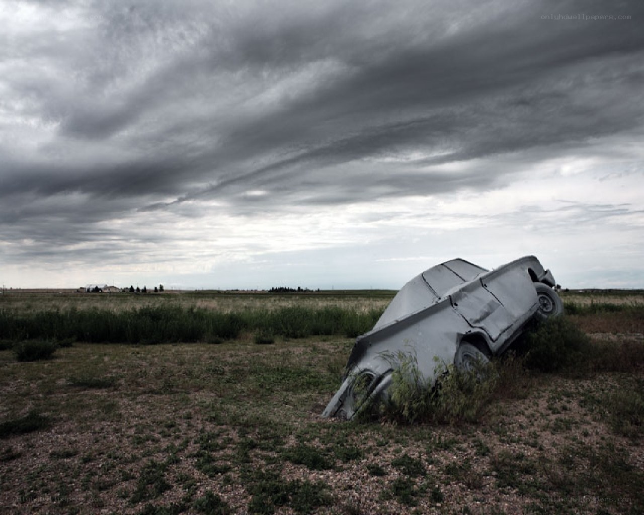 Abandoned car in a field