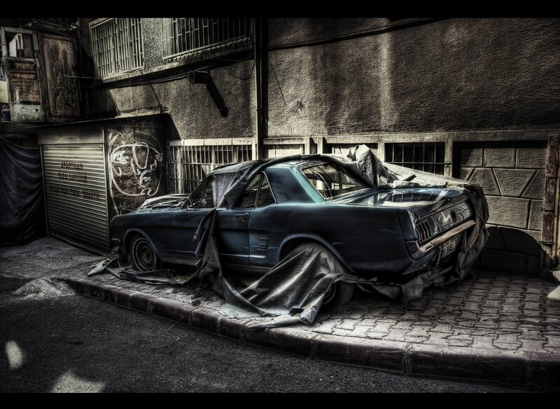 Abandoned car in alley