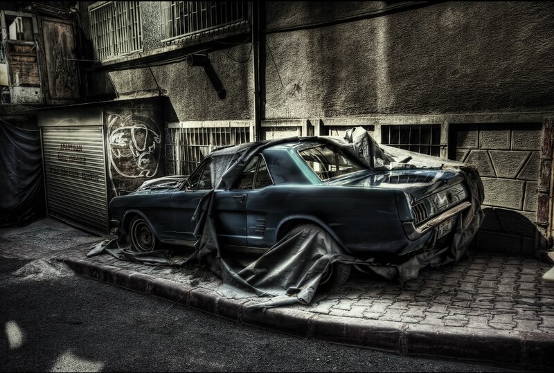 Abandoned car in alley