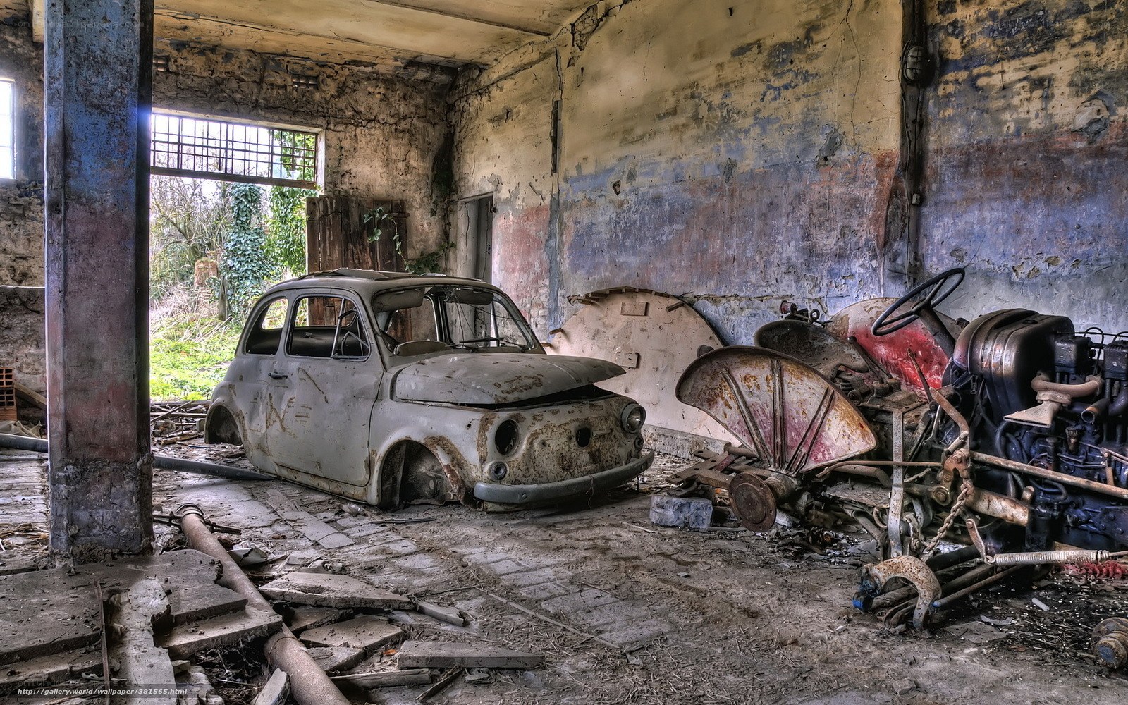Abandoned car in derelict garage