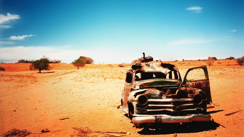 Abandoned Car in Desert — Blue, Desolate, Afternoon