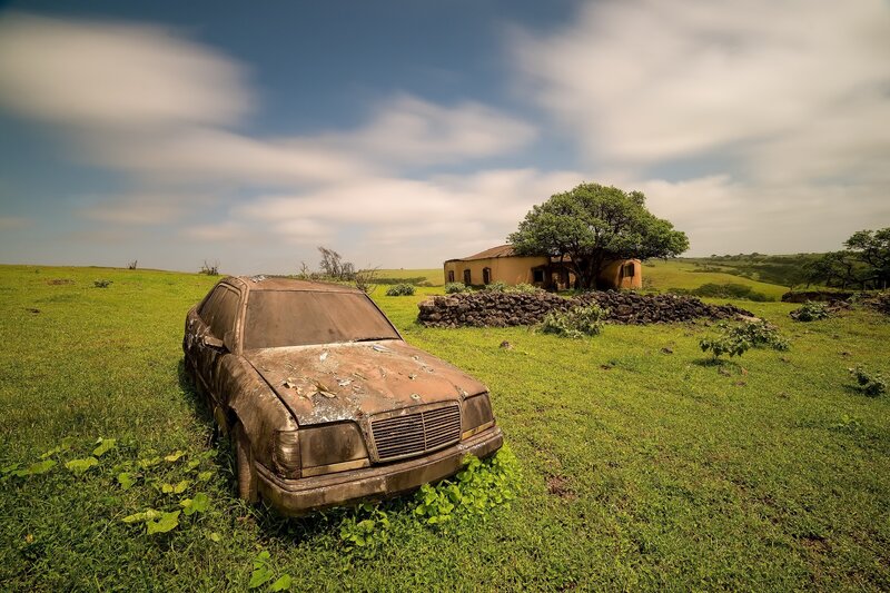 Abandoned Car in Field — Green, Desolate