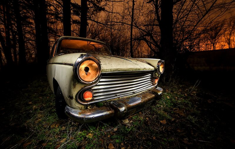 Abandoned Car in Forest — Orange