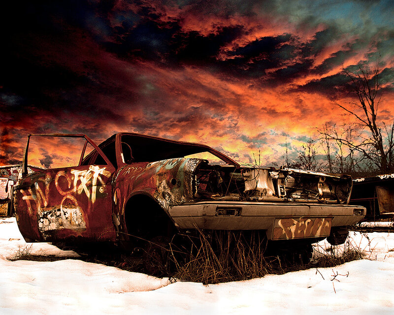 Abandoned car in snowy wasteland