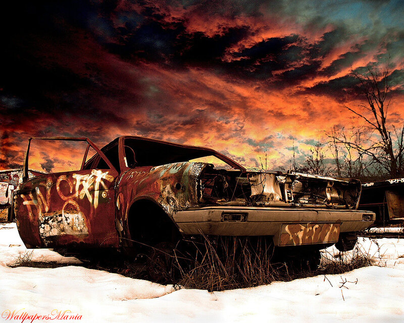 Abandoned car in snowy wasteland
