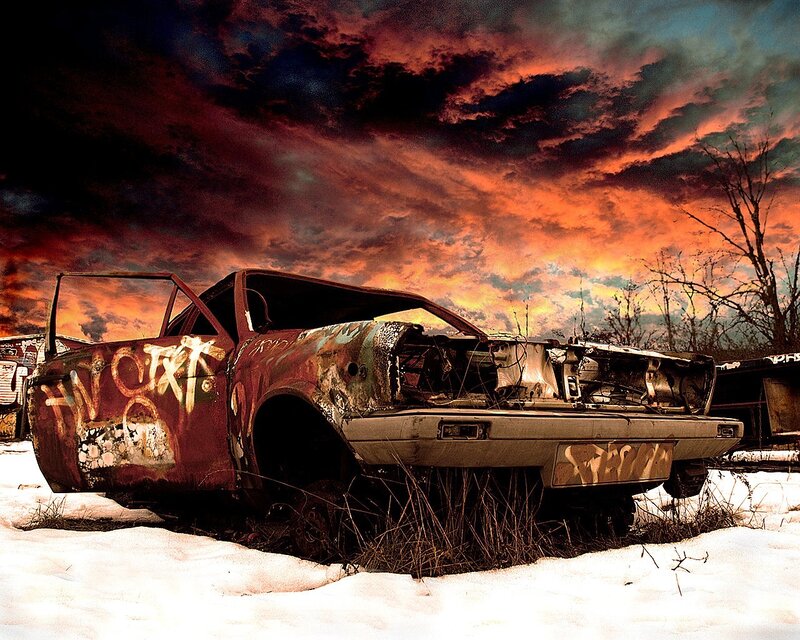 Abandoned car in snowy wasteland