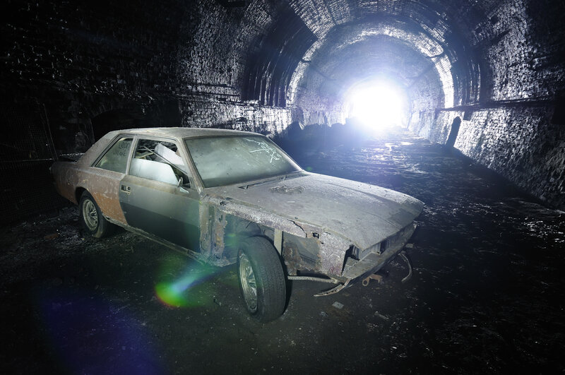 Abandoned car in tunnel