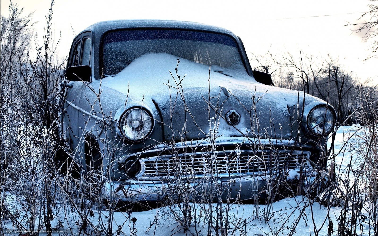 abandoned car in winter