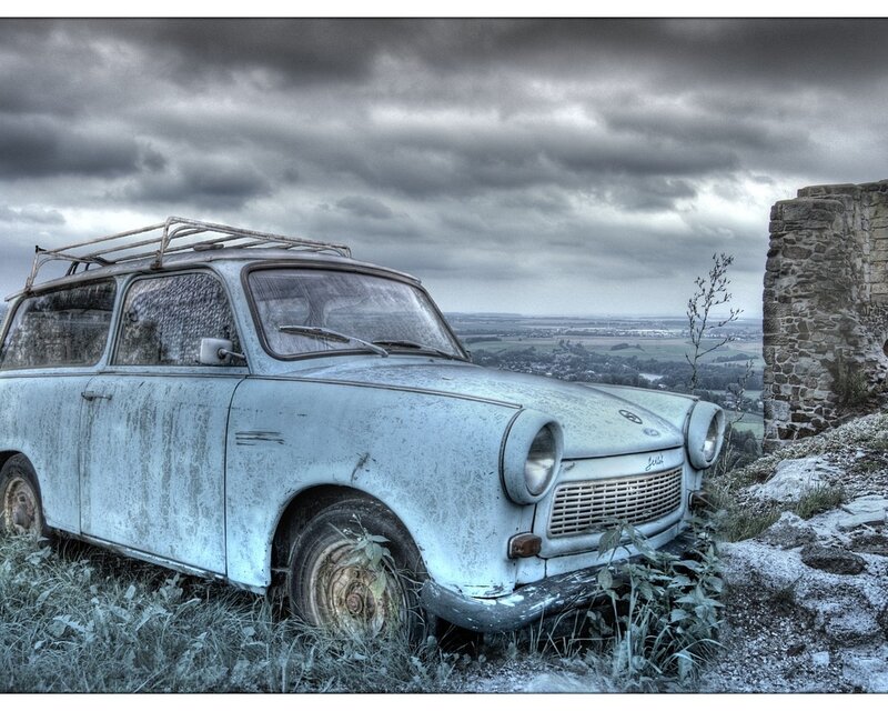 Abandoned Car on Hillside