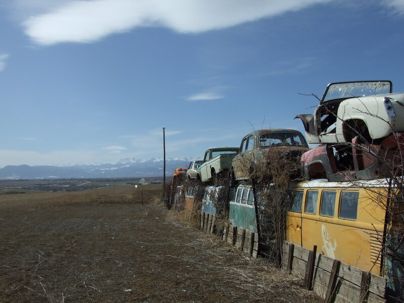 Abandoned cars in a field