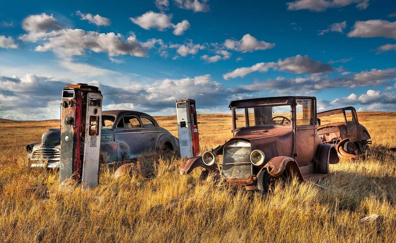 Abandoned Cars in Field