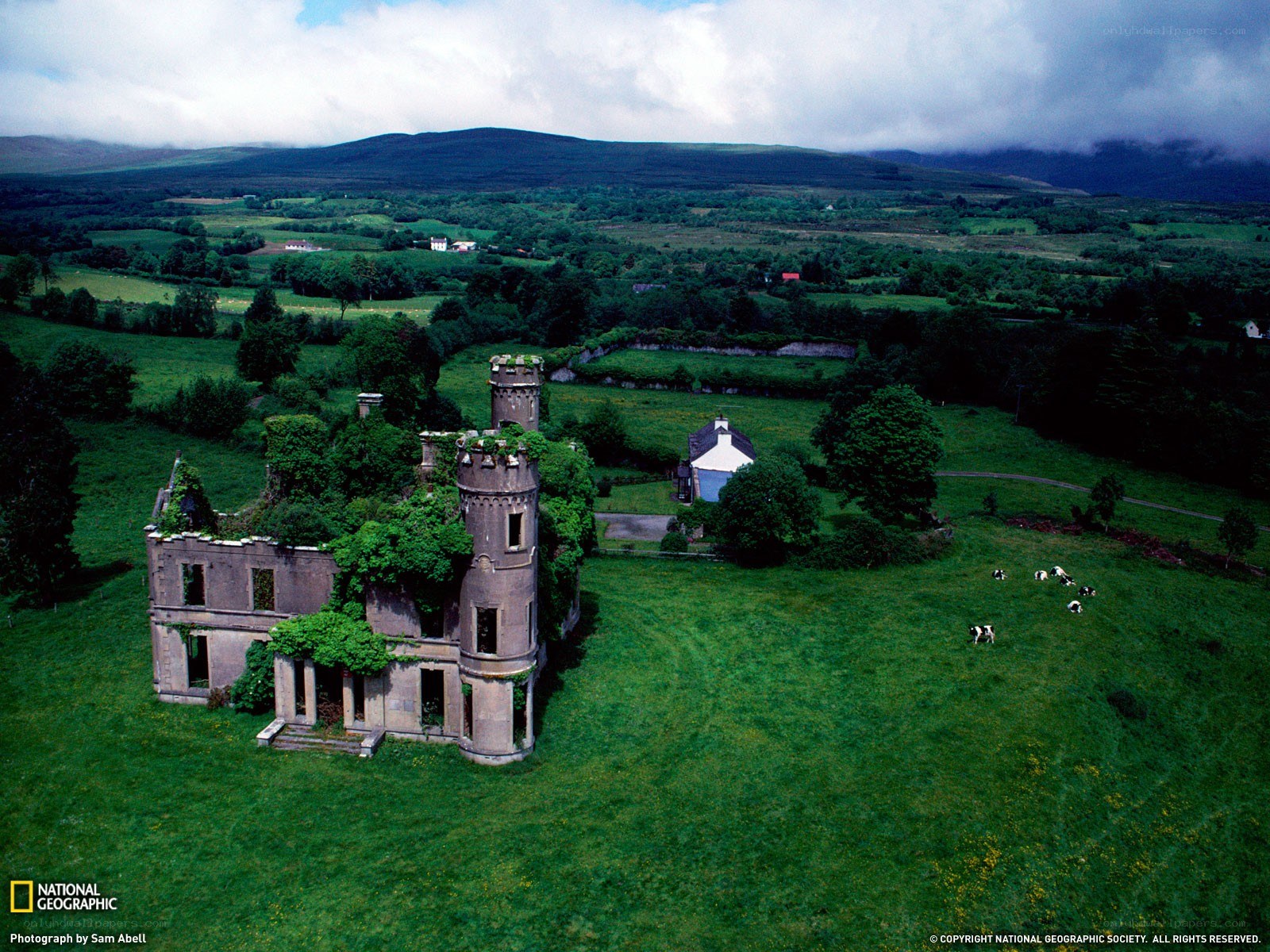Abandoned castle in green fields