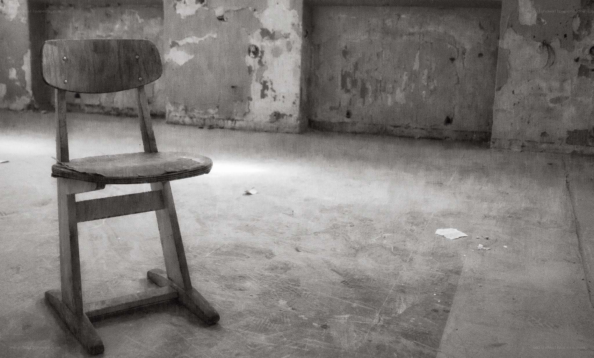 abandoned chair in empty room