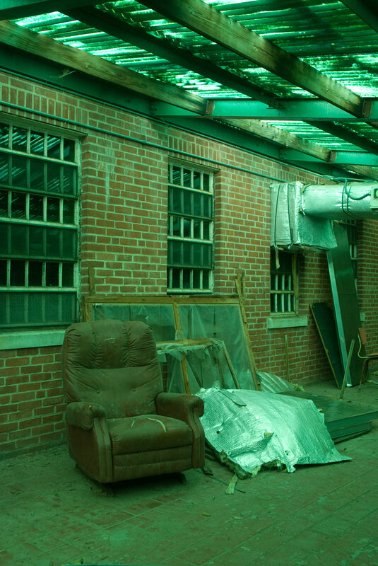 abandoned chair under green roof