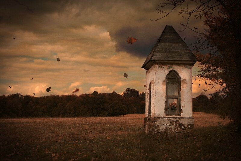 Abandoned chapel in autumn field
