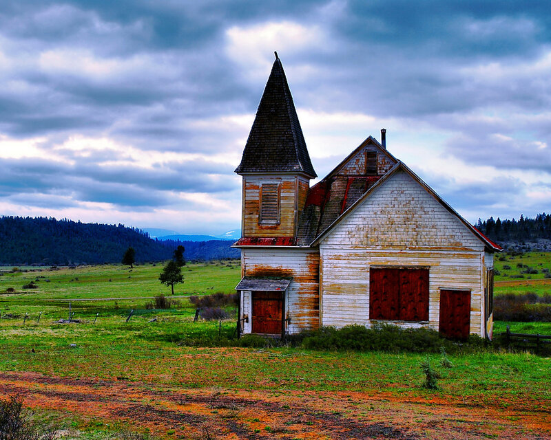 Abandoned church in a green field
