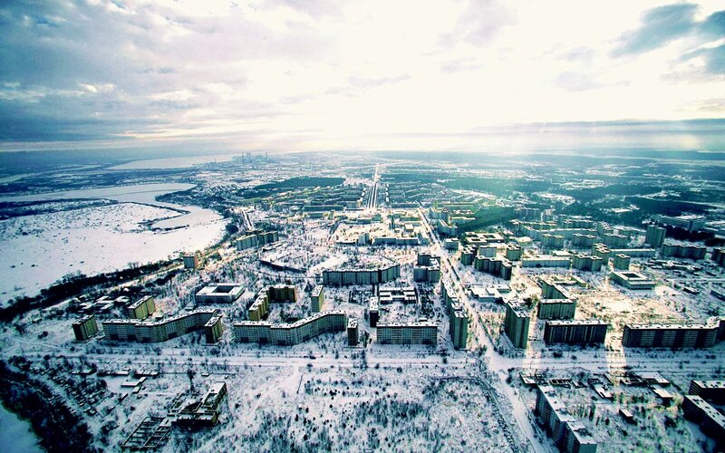 Abandoned City in Winter — White, Desolate, Photograph, Snow, Apartment Buildings, River, Forest