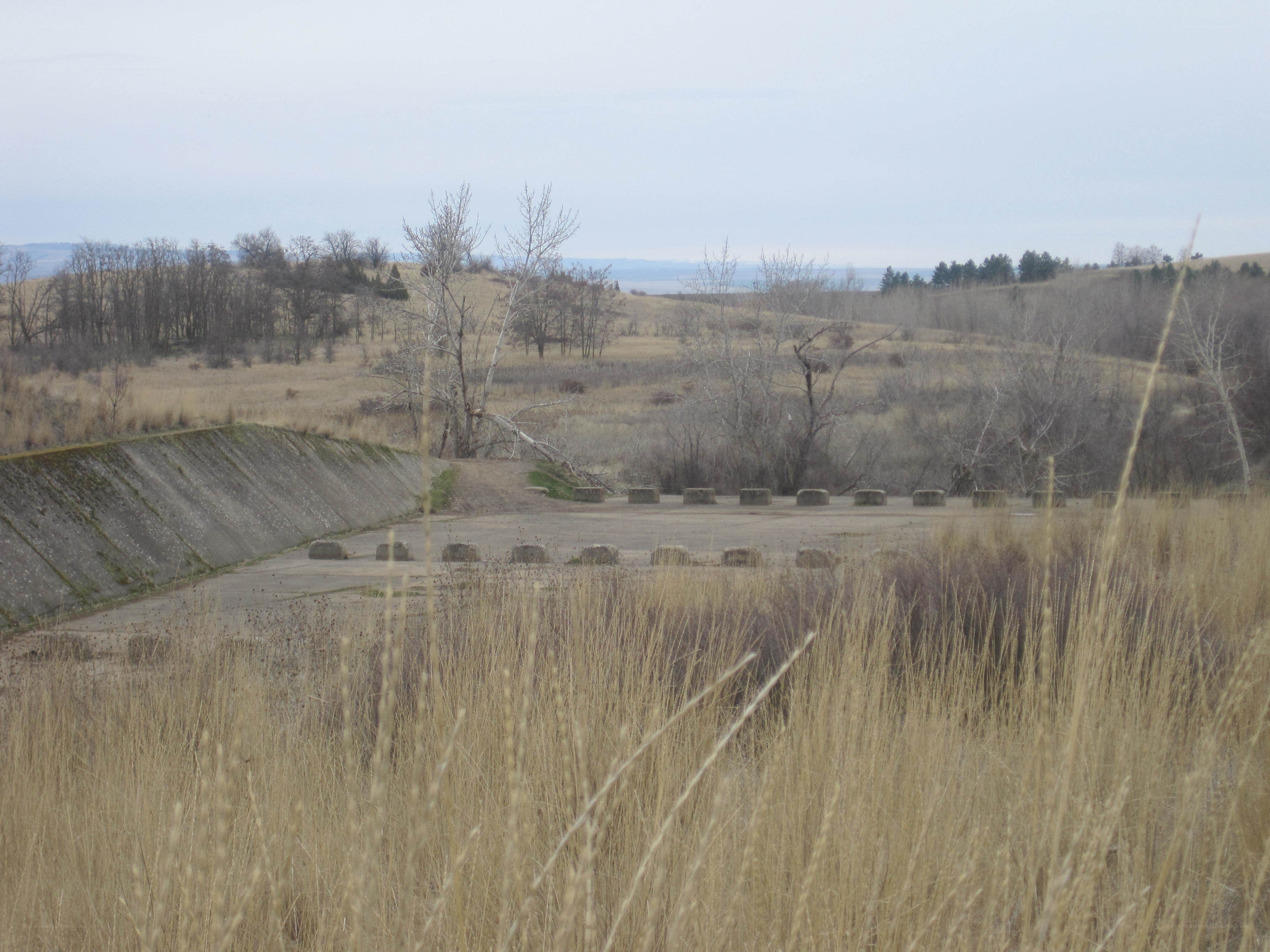 abandoned concrete structure in field