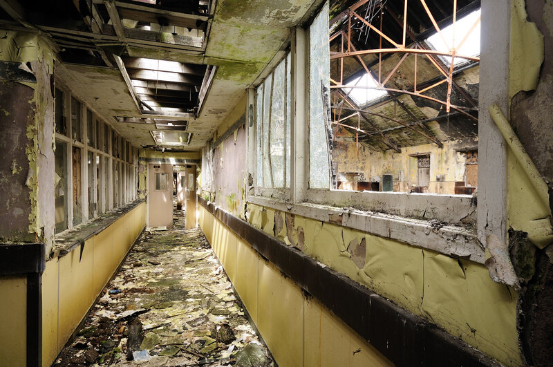 Abandoned corridor with broken windows