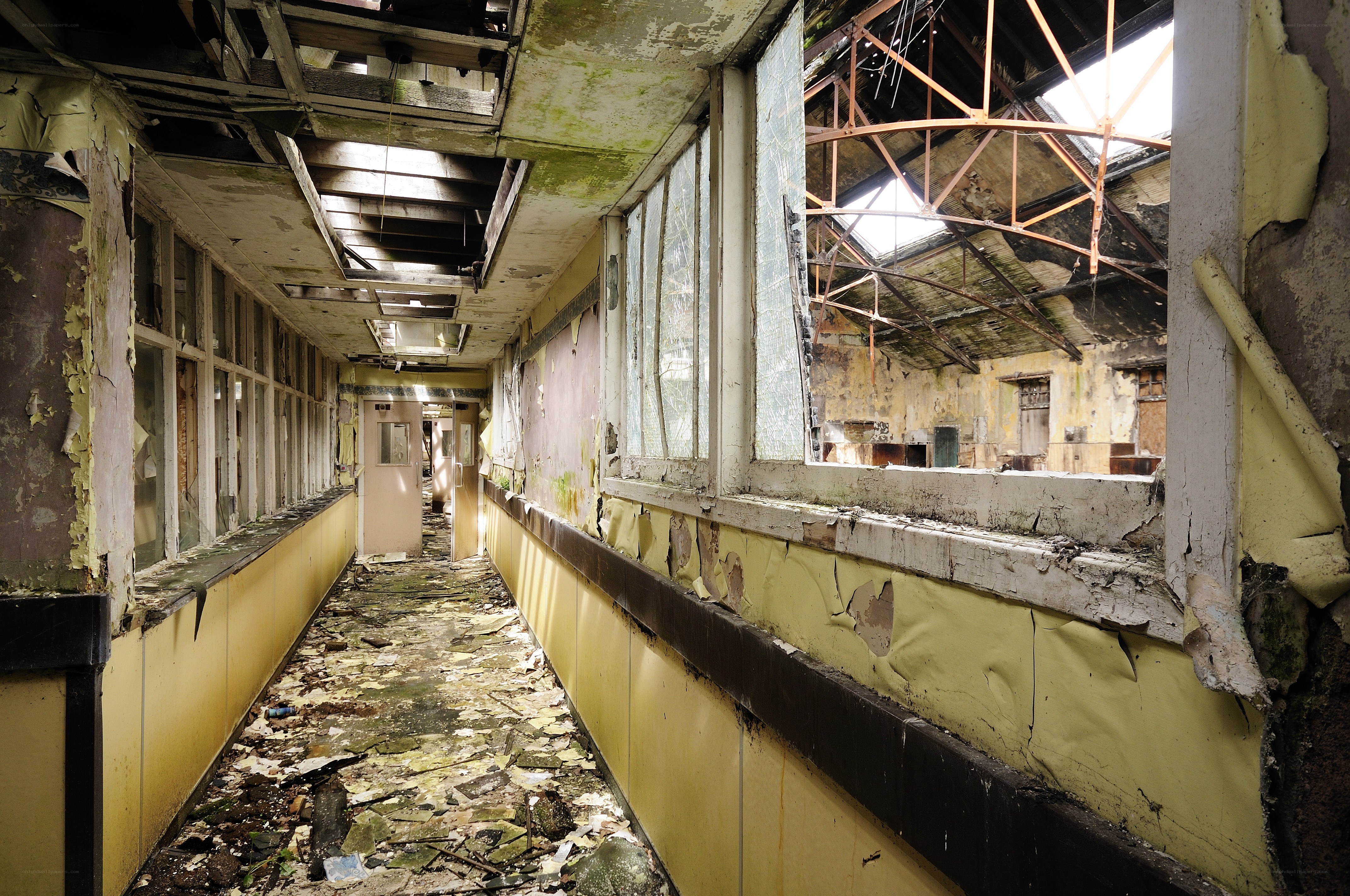 Abandoned corridor with broken windows
