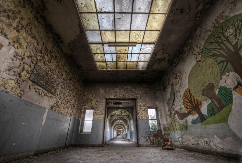 Abandoned corridor with mural